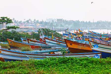 Kollam, India - 14 February 2016: Typic street of Kollam pier marine close to Fishing boats on the beach of Kollam, Indiaのeditorial素材