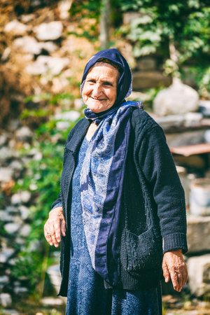 Lahic, Azerbaijan - July 18, 2015: Portrait of old woman living in the oldest building in Lahich, located on the mountain in Lahicのeditorial素材