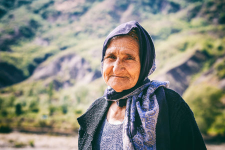 Lahic, Azerbaijan - July 18, 2015: Portrait of old woman living in the oldest building in Lahich, located on the mountain in Lahicのeditorial素材
