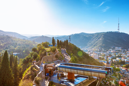 Tbilisi, Georgia - October 05, 2016: funicular station, aerial view from the top of cockpit on the roofs of the old city of Tbilisi: houses with traditional wooden carving balconies, famous Georgian architecture of Old Town of Tbilisi, Georgiaのeditorial素材