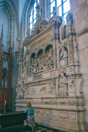 Krakow, Poland - April 15, 2018: women pray in The side altar, praying stalls and benches in the Roman Catholic church of St. Catherine of Alexandria, Augustinian Monastery interiorのeditorial素材