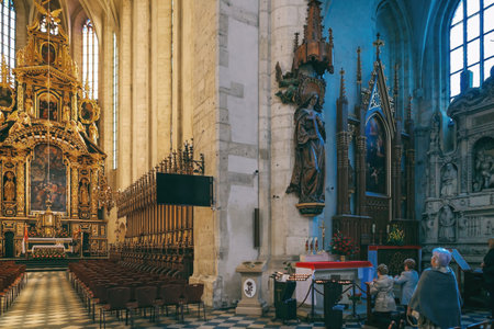 Krakow, Poland - April 15, 2018: The main altar, Choir stalls and benches in the church of St. Catherine in Krakowのeditorial素材