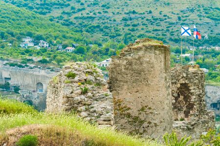 The ruins of the ancient fortress in Crimea, Inkerman. The ruins of the ancient city. The fortress on the cliffs. Ruined wall of ancient medieval fortress. Remains of an ancient fortressの写真素材
