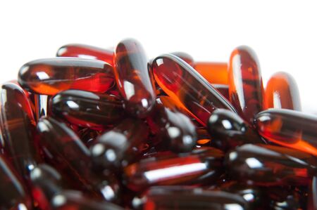 Red pills isolated on a white backgroundの写真素材
