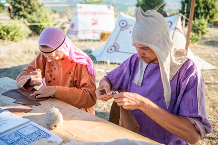 SEVASTOPOL, RUSSIA - SEPTEMBER 11, 2016Grain leather. Shoemaker performs shoes in the ancient studio craftのeditorial素材