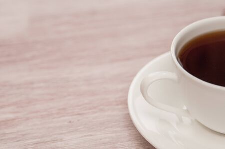 Half Cup of tea on a old wooden backgroundの写真素材