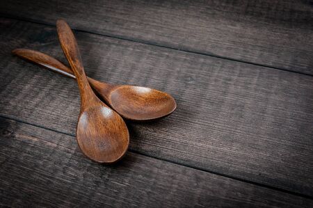 wooden spoons on table background, closeup, free space for your textの写真素材