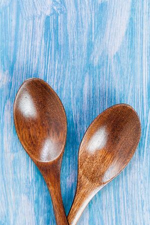 wooden spoons on table background, closeup, free space for your textの写真素材