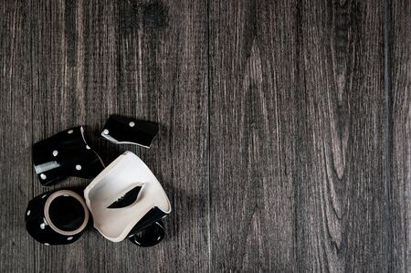 smash cup of coffee on wooden backgroundの写真素材