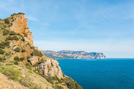 Rocky cliff above the beautiful clear blue Sea, Crimea, Balaklavaの写真素材
