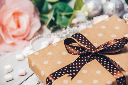 Gift box kraft paper polka dots light focus background. Holiday greeting cardの写真素材