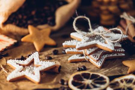 Tasty Gingerbread cookies, stars and flowers, food closeup on a tableの写真素材
