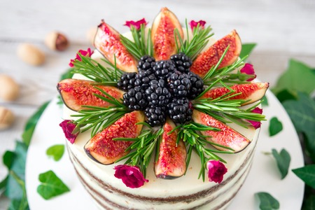 delicious and very pretty carrot walnut cake with figs and rosemary.の写真素材