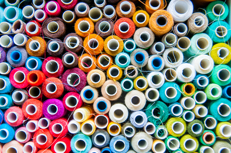 few nice colorful bobbins in big boxの写真素材