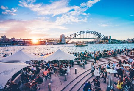 Famous sunset over Sydney Harbour Bridge. Stunning view of the waterfront near the Opera houseのeditorial素材