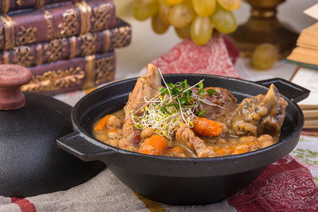 Traditional thick soup made from sauerkraut with pork, smoked pork ribs, sausages, capers and lemonの写真素材