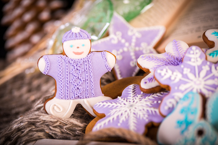 Gingerbread christmas cookies, snowflakes an gingerman. Knitted scarf and cinnamon sticks. 2019 New Year.の写真素材