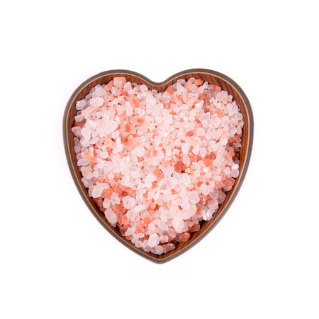 Himalayan pink salt in ceramic bowl, isolatedの写真素材