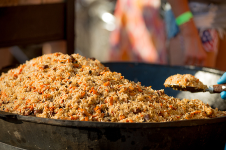 Uzbek pilaf at the festival of street food.の写真素材