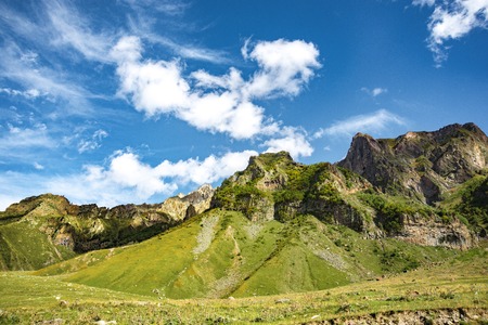 summer mountains green grass and blue sky landscape.の写真素材