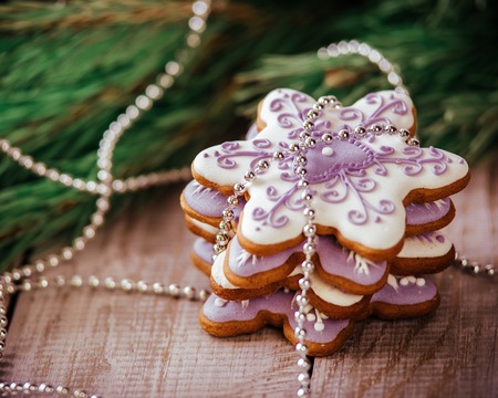 Christmas composition - gingerbread cookie, anise and cinnamon on wooden table.の写真素材