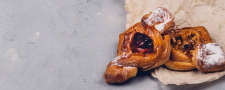 Bakery products on baking paper on stone table. Copy space for your text, banner.の写真素材