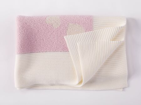 Soft and warm folded pink alpaca wool blanket with fringe