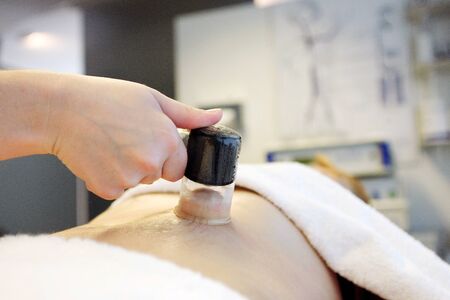 Vacuum massage. Procedure in cosmetic cabinetの写真素材