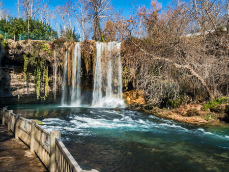 Observation deck for watching the waterfall in Antalya, Turkey. Beautiful mountain waterfall. Water quickly flows down the river. Water landscape. No peopleの写真素材
