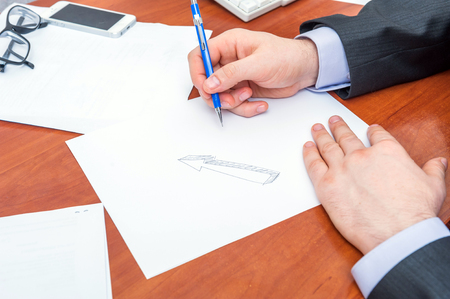 Businessman signs documentsの写真素材
