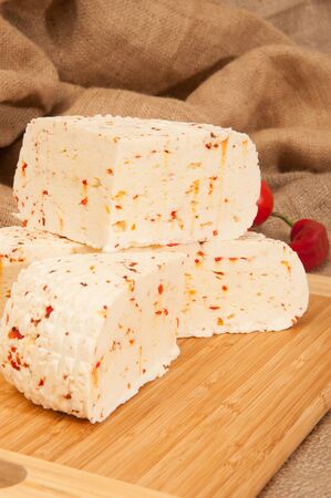 Cheese with vegetables and herbsの写真素材