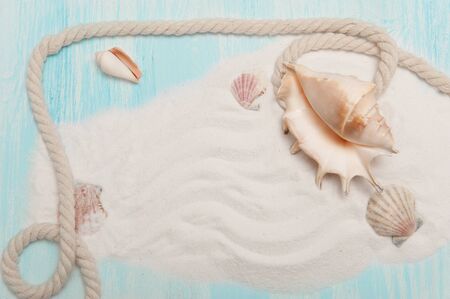 Sea background with white sand and blue painted wood, starfish, shellsの写真素材
