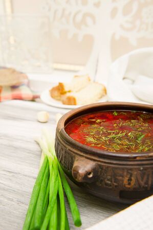 Ukrainian borsch with green onions, bread and garlic.. National foodの写真素材