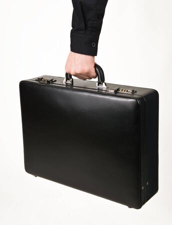 Black office suitcase for papers in the hand on a white backgroundの写真素材
