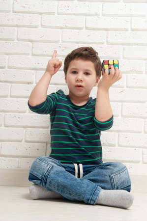 Kiev, Ukraine, 22 march 2020. boy plays with rubiks cube. Rubiks Cube invented by a Hungarian...