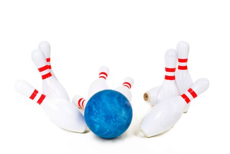 Bowling skittles and bowling ball on a white background.の写真素材