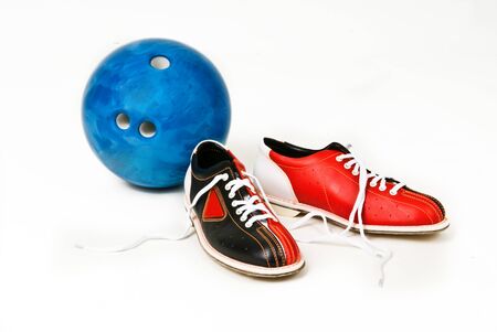 Bowling skittles and shoes on a white background.
