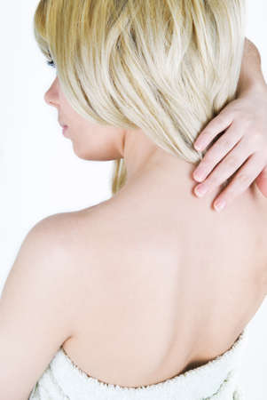 Girl rubs cream on the neckの写真素材