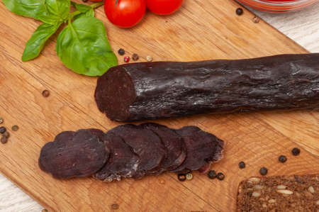 Horse sausage mahan on a wooden boardの写真素材