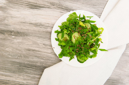 Fresh green salad on plate top viewの写真素材