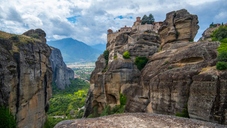 Meteora, Kalabaka, Greece. Monastery. Panorama of high rocks and mountains with monasteries. cloudy...