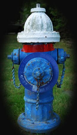 Red, white, and blue fire hydrantの写真素材