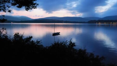 Shadows on a lake at duskの写真素材