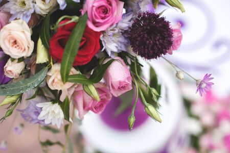 Beautiful wedding colorful bouquet for bride. Beauty of colored flowers. Close-up bunch of florets. Bridal accessories. Female decoration for girl. Details for marriage and for married couple.の写真素材