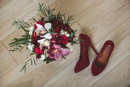 Beautiful wedding colorful bouquet for bride. Beauty of colored flowers. Close-up bunch of florets. Bridal accessories. Female decoration for girl. Details for marriage and for married coupleの写真素材