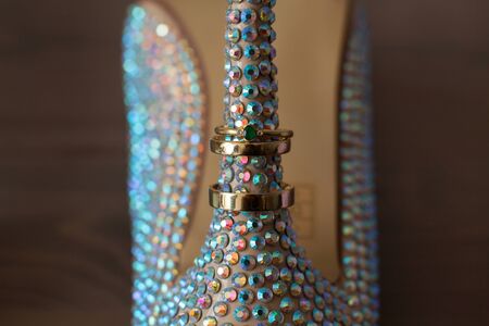 The elegant wedding shoes with colored rhinestones.の写真素材
