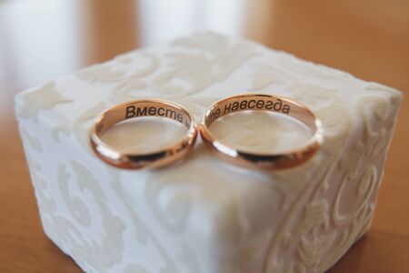 Elegant gold engagement rings in wooden boxの写真素材