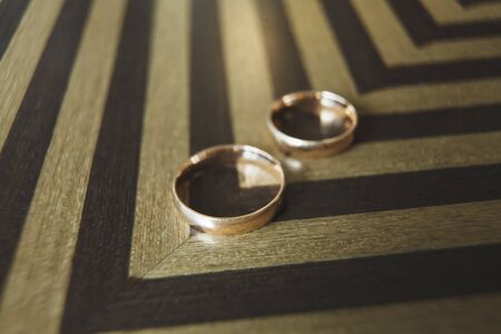 Elegant gold wedding rings of the bride and groomの写真素材