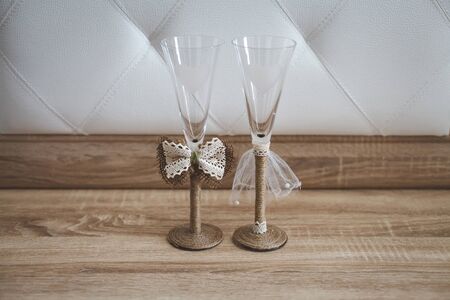 Pair of wedding champagne glasses. The decor of the bride and groomの写真素材