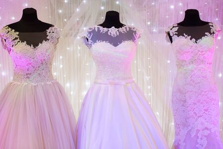 Beautiful wedding dresses on mannequins in the storeの写真素材
